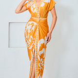 Model wearing floral print v-neck midi dress in mustard