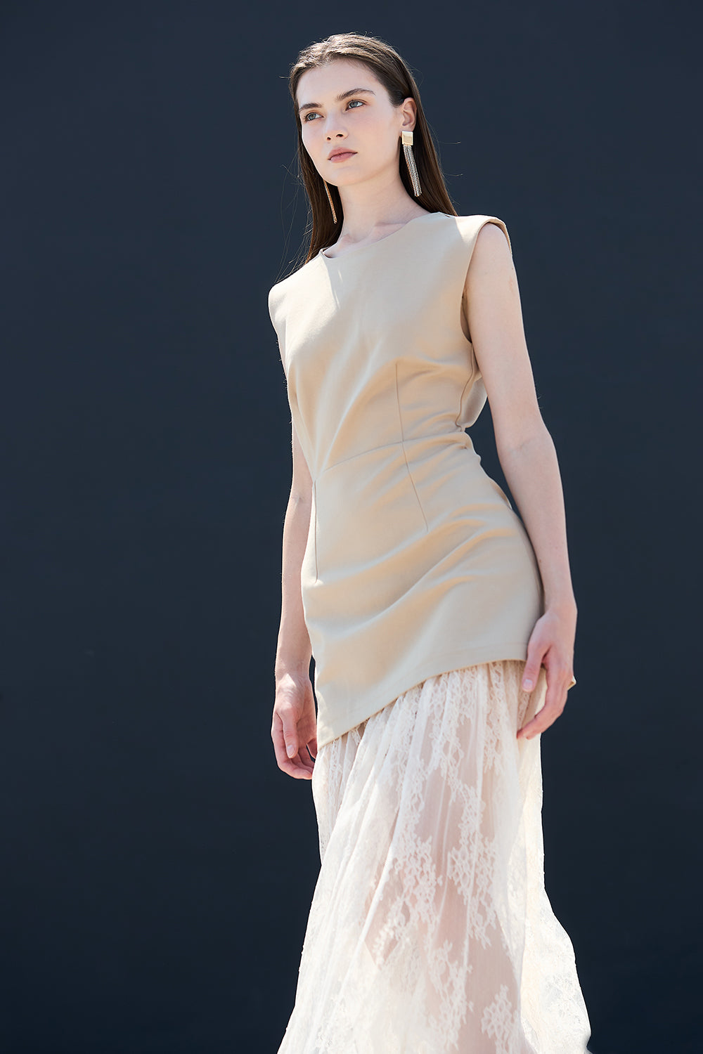 Beige sleeveless maxi dress paired with white lace layered skirt chic California fashion for women