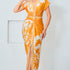 Model wearing floral print v-neck midi dress in mustard