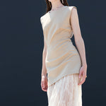 Beige sleeveless maxi dress paired with white lace layered skirt chic California fashion for women