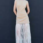 Front view of taupe sleeveless mini dress layered with sheer lace maxi skirt women’s trendy fashion outfit